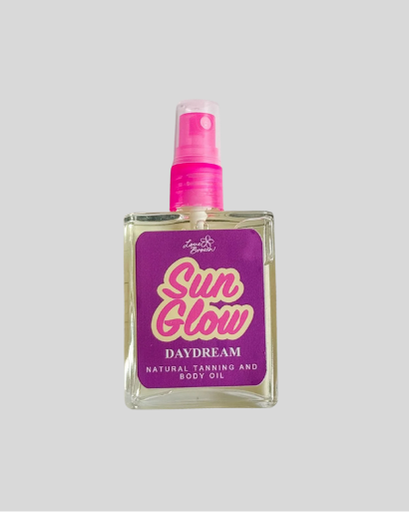 Bottle of 'Sun Glow Daydream' natural tanning and body oil with a pink spray nozzle 