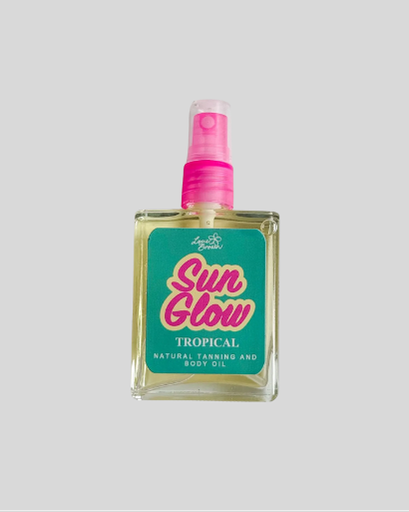 Bottle of 'Sun Glow' tropical natural tanning and body oil with a pink spray nozzle