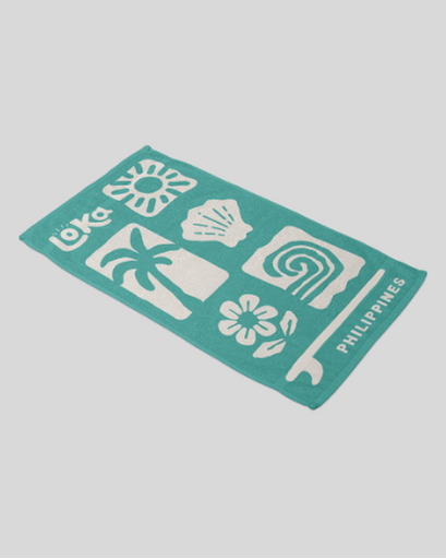 Teal towel with white patterns and 'Loka Philippines' text 
