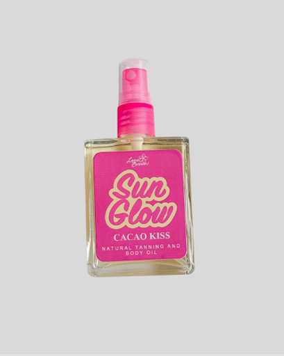 Bottle of 'Sun Glow Cacao Kiss' tanning and body oil with pink spray nozzle 