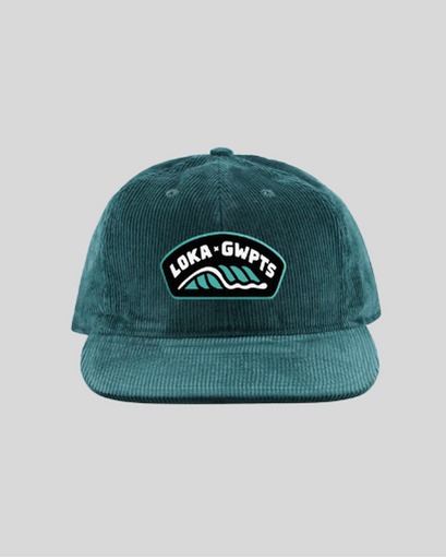 Green corduroy cap with a logo on a gray background