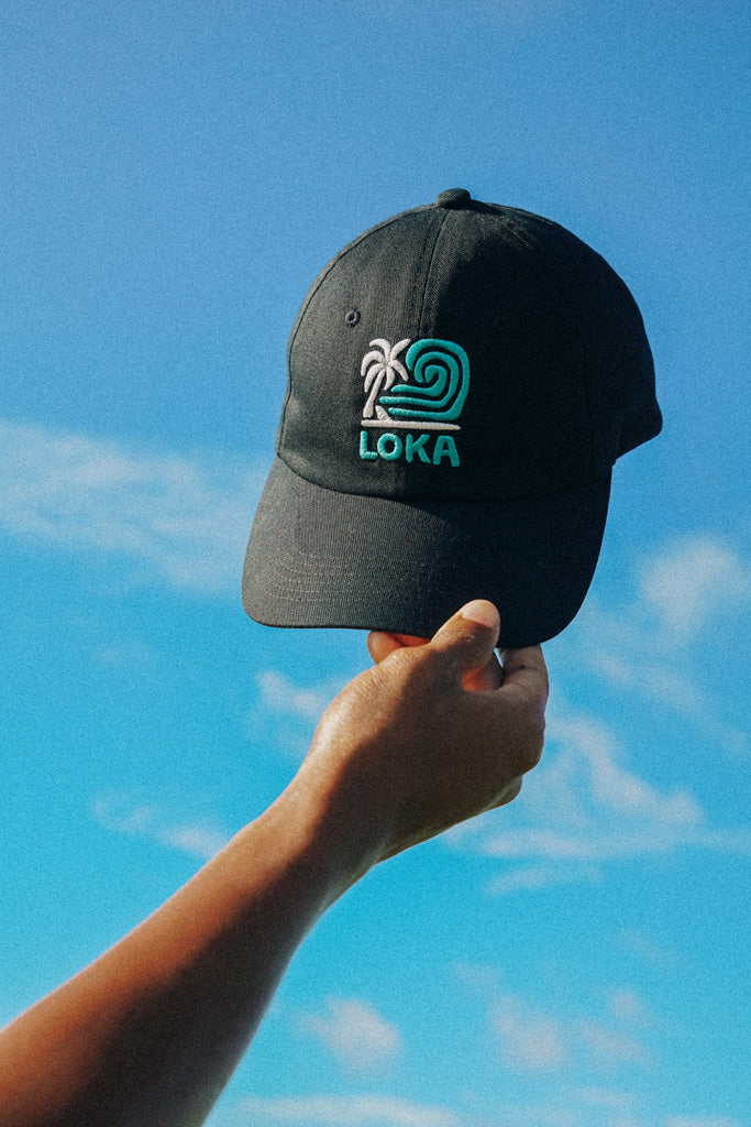 'Swell Dad Cap' from the On Cloud 9 Collection, against a blue sky background