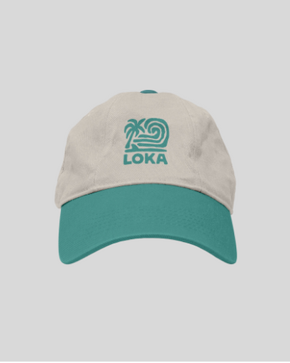 white and teal cap with 'LOKA' logo 